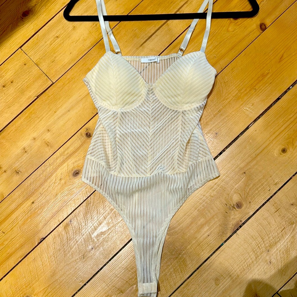 Cream colored tank bodysuit